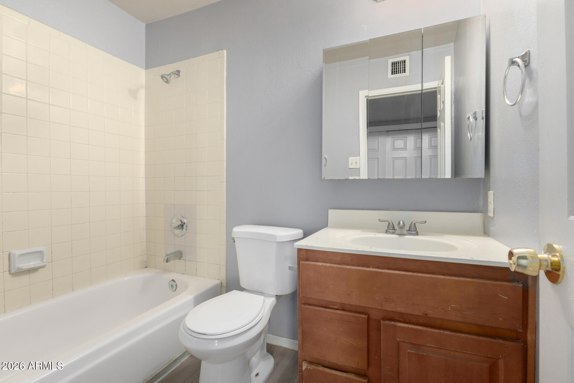 3936 West Camelback Road Phoenix, AZ 85019 - Photo 15 of 19 a bathroom with a sink toilet and bathtub