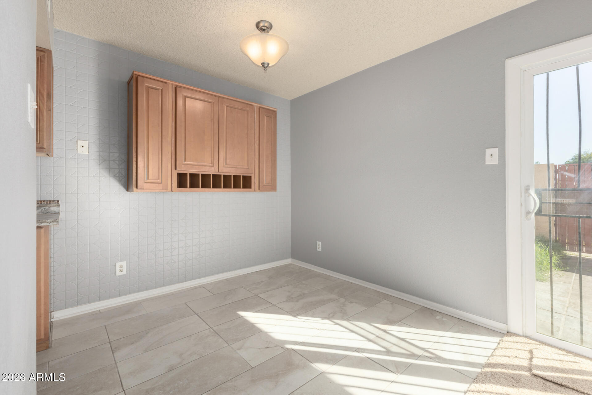 3936 West Camelback Road Phoenix, AZ 85019 - Photo 5 of 19 an empty room with windows