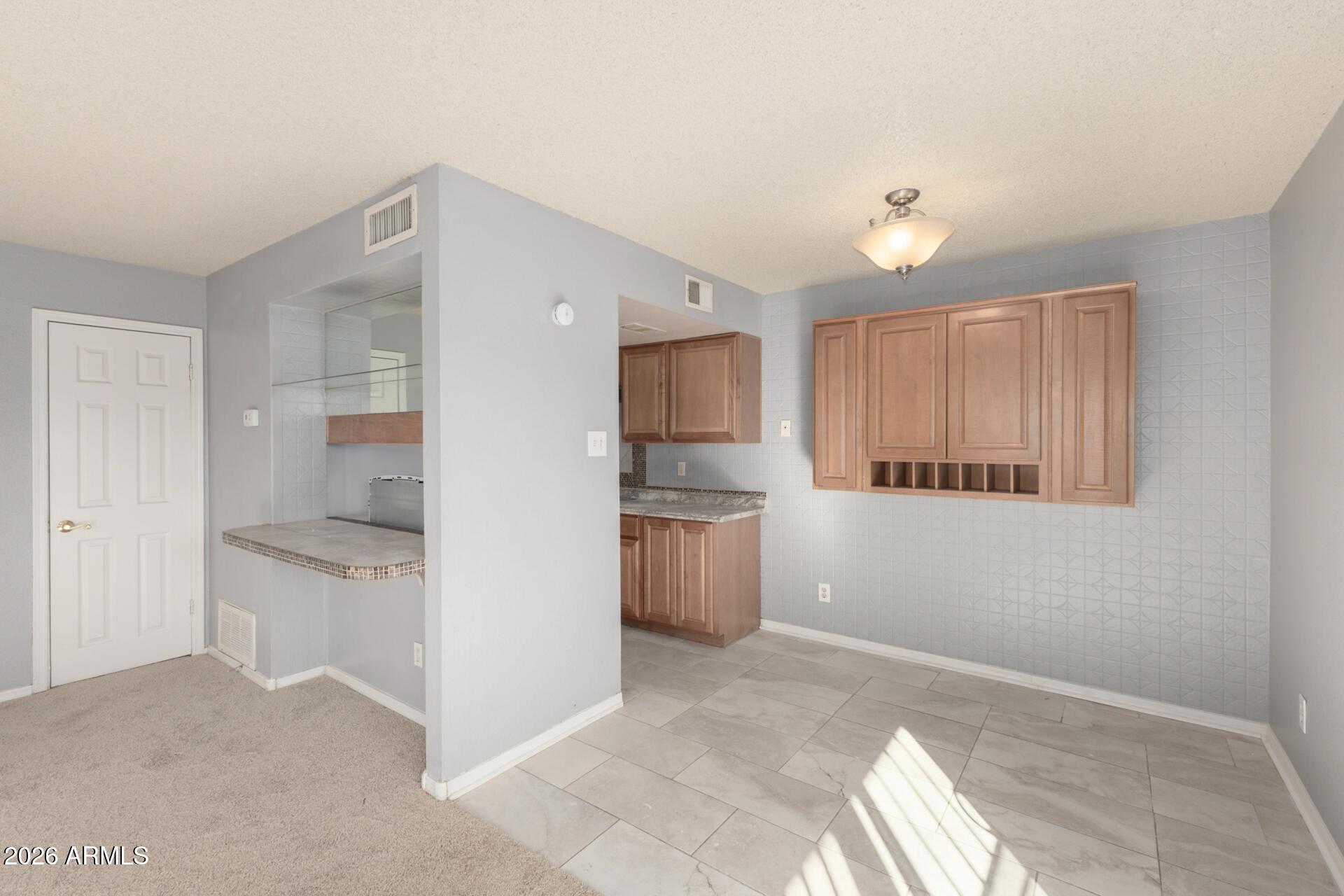 3936 West Camelback Road Phoenix, AZ 85019 - Photo 6 of 19 a view of a kitchen with a sink and an oven