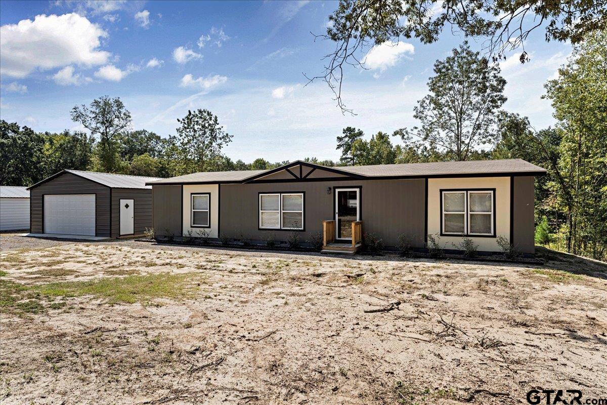 a house with yard in front of it