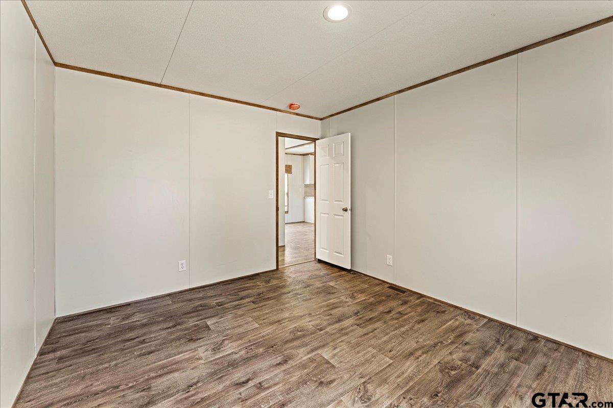 4776 County Road 4509 Athens, TX 75752 - Photo 19 of 25 a view of a room with wooden floor