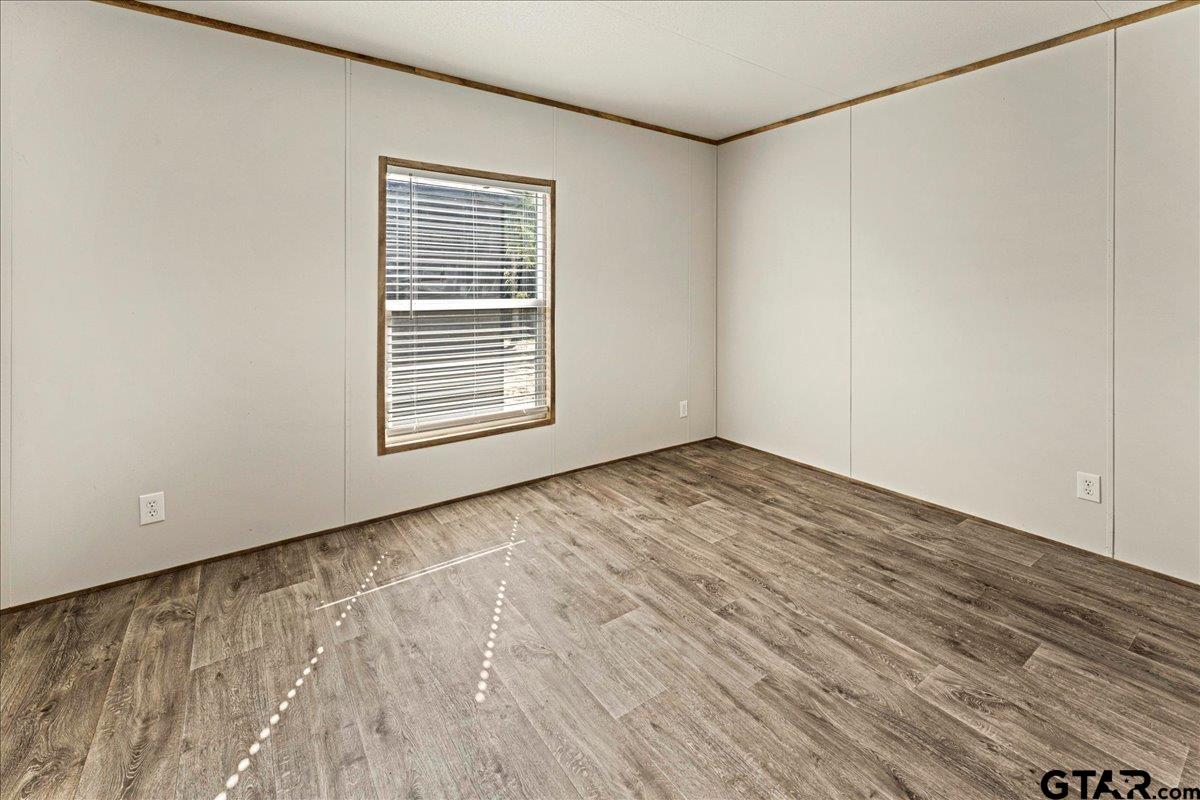 4776 County Road 4509 Athens, TX 75752 - Photo 21 of 25 a view of empty room with wooden floor and fan
