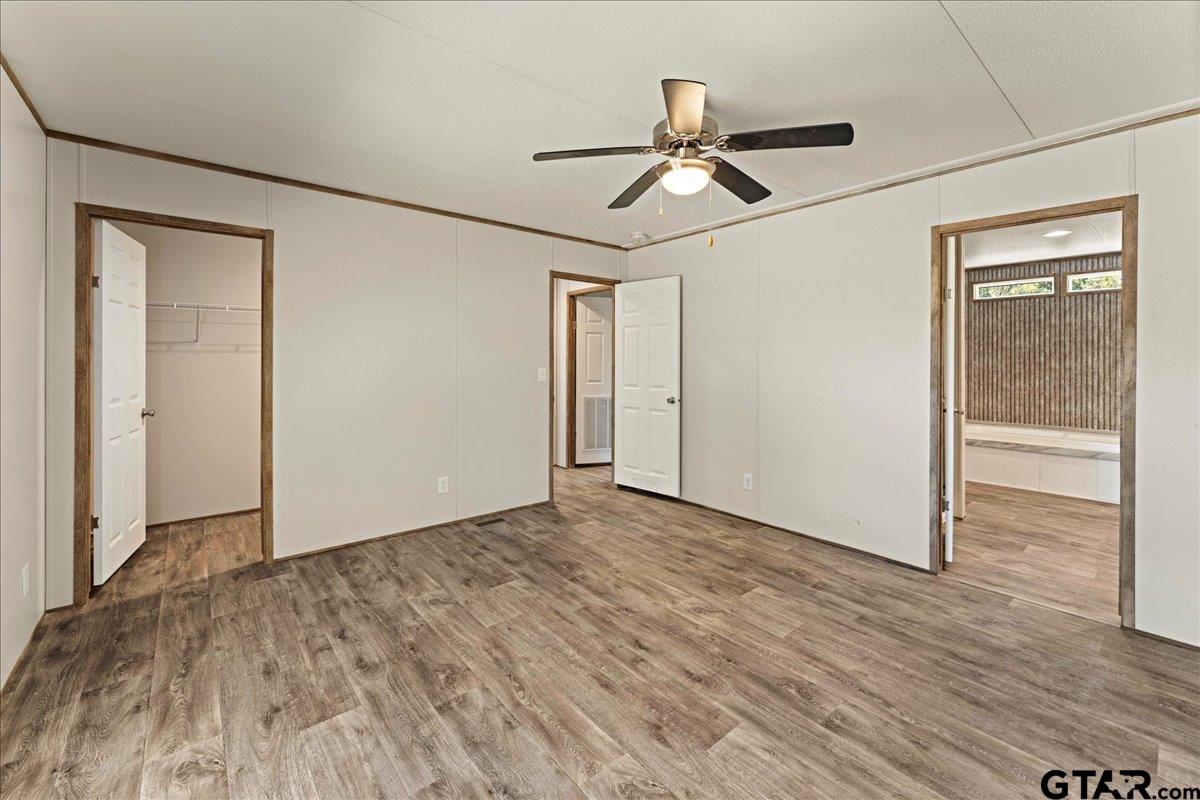 4776 County Road 4509 Athens, TX 75752 - Photo 25 of 25 a view of empty room with wooden floor and fan