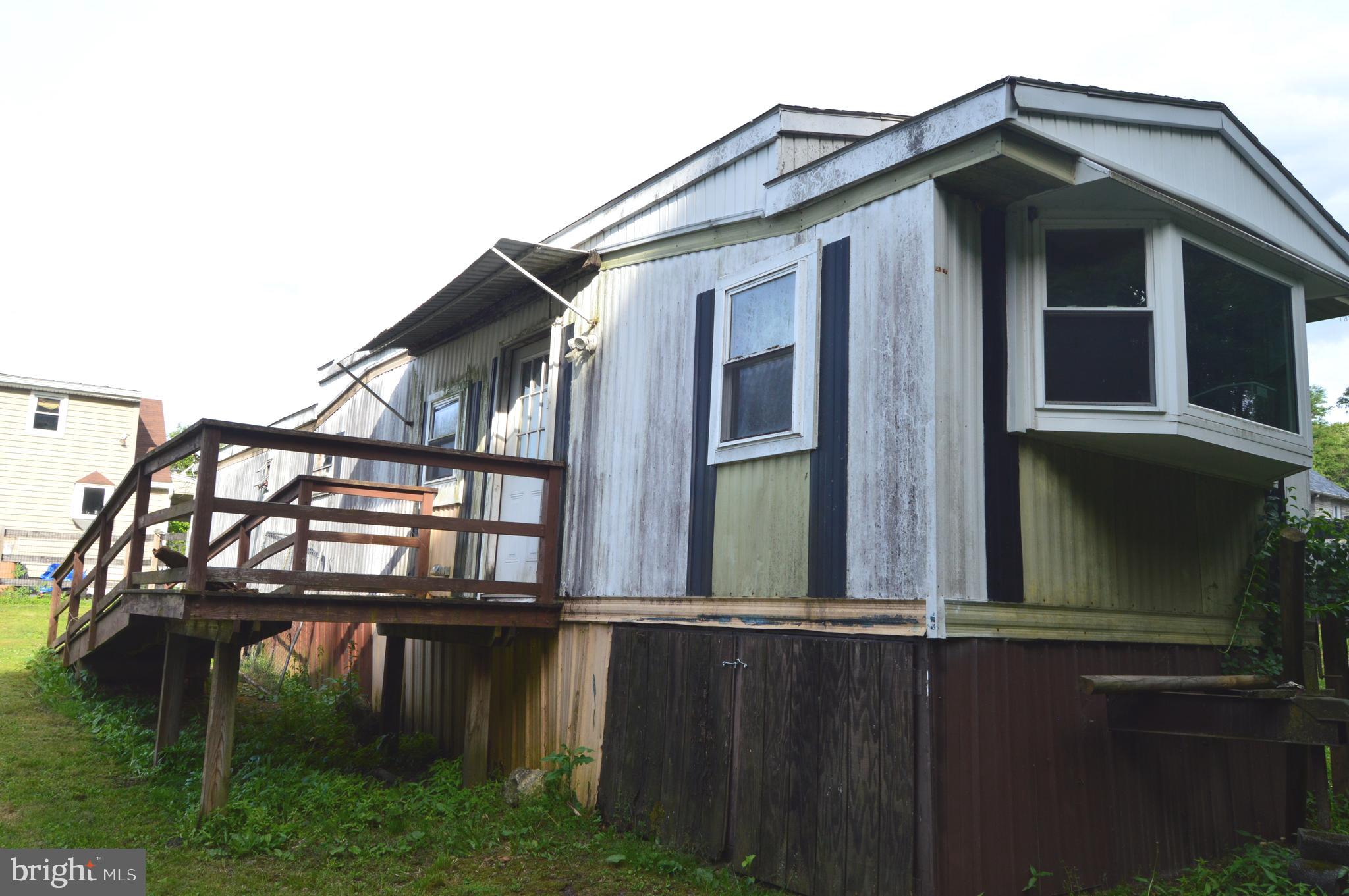 46 Mountain Spring Road Blandon, PA 19510 - Photo 12 of 18 a view of a house with yard and deck