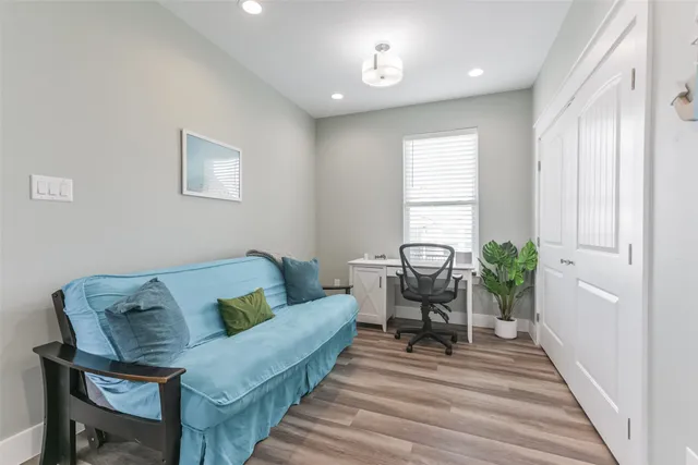 a living room with furniture and a rug