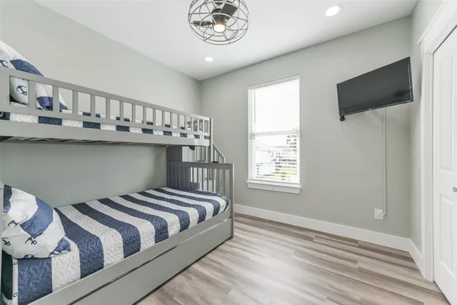 a bedroom with bed and a window