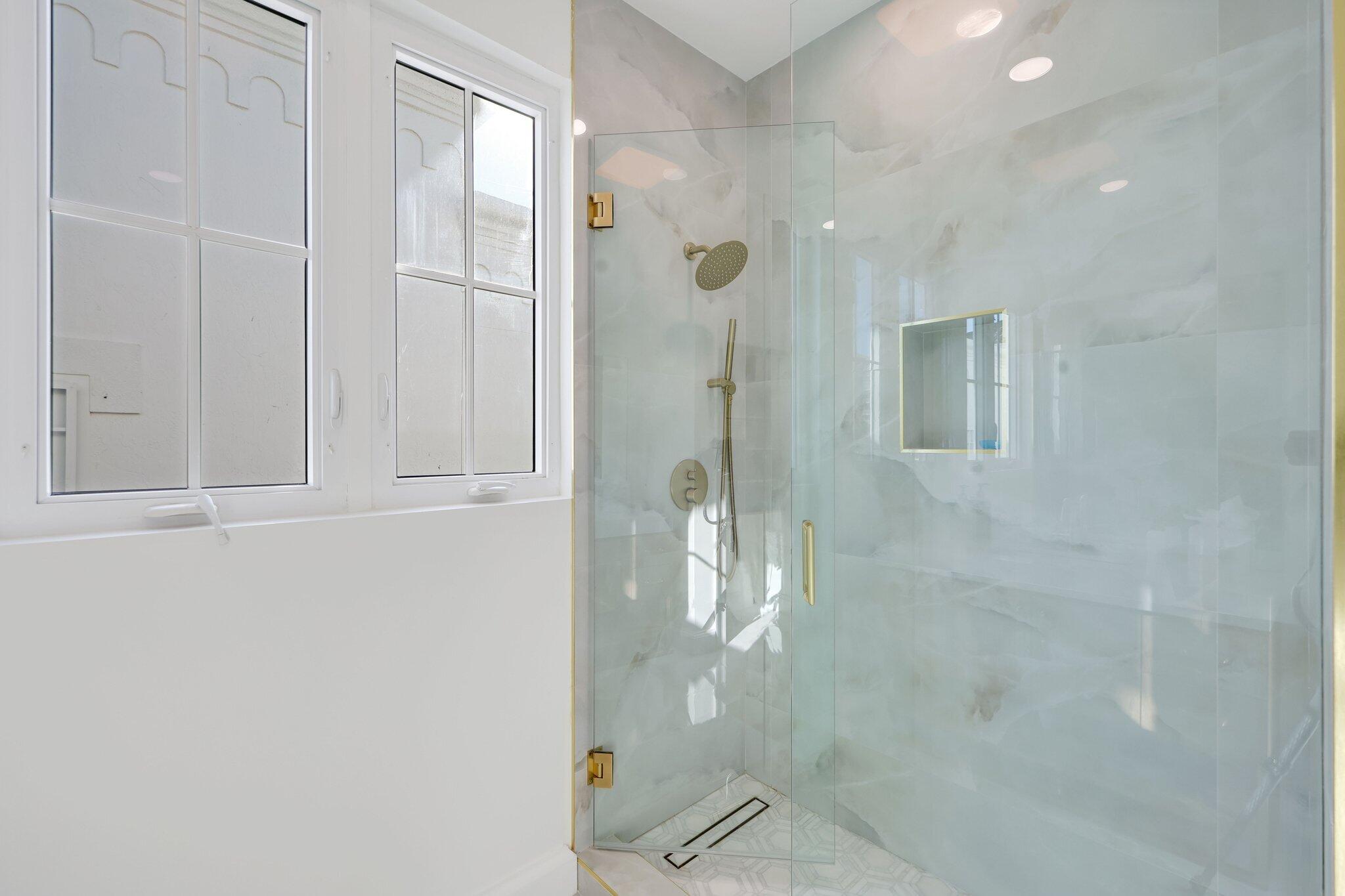 340 East Royal Palm Road Boca Raton, FL 33432 - Photo 38 of 59 a bathroom with a glass shower door