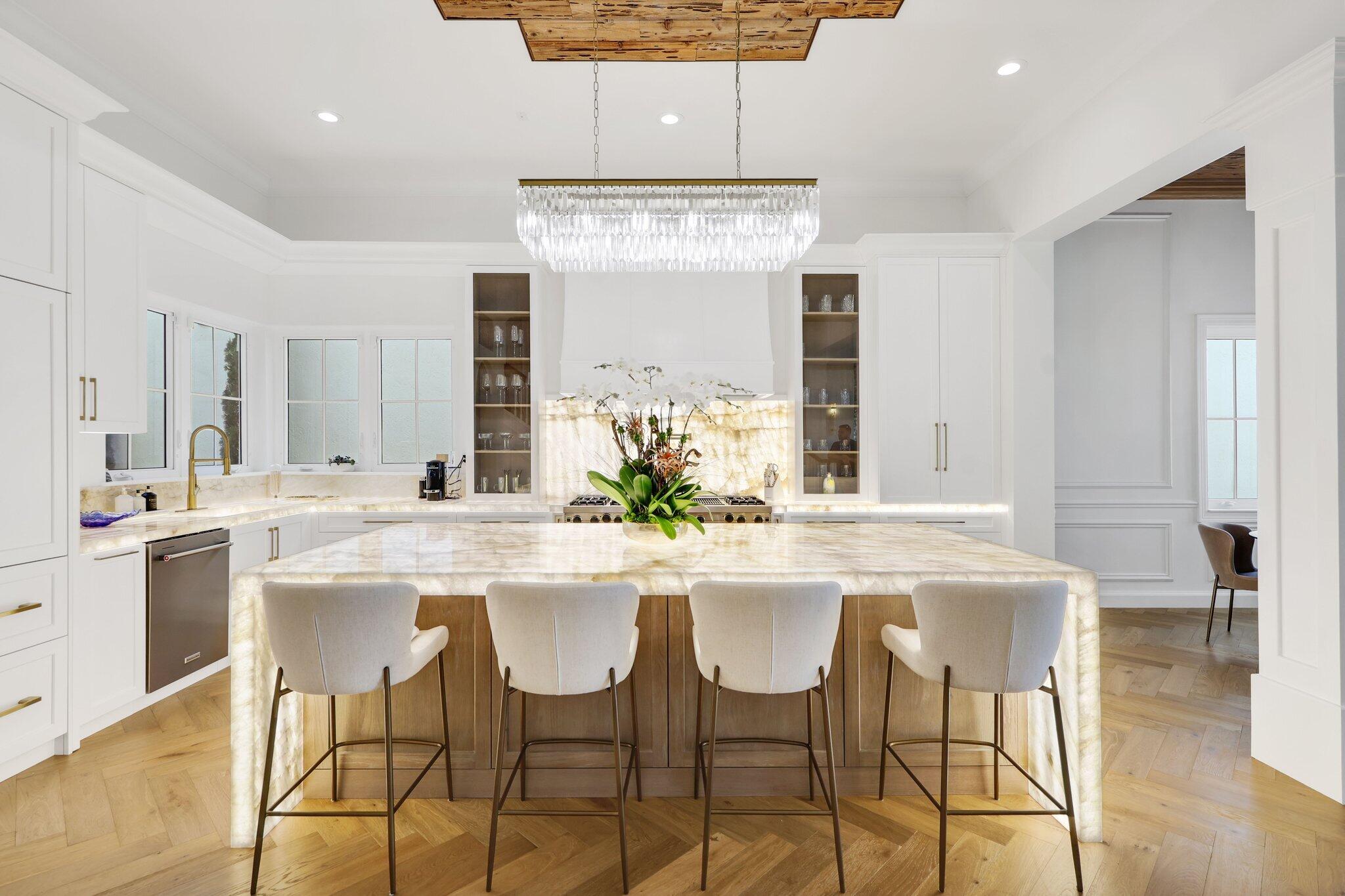 340 East Royal Palm Road Boca Raton, FL 33432 - Photo 5 of 59 a kitchen with stainless steel appliances kitchen island granite countertop a dining table chairs and granite counter tops