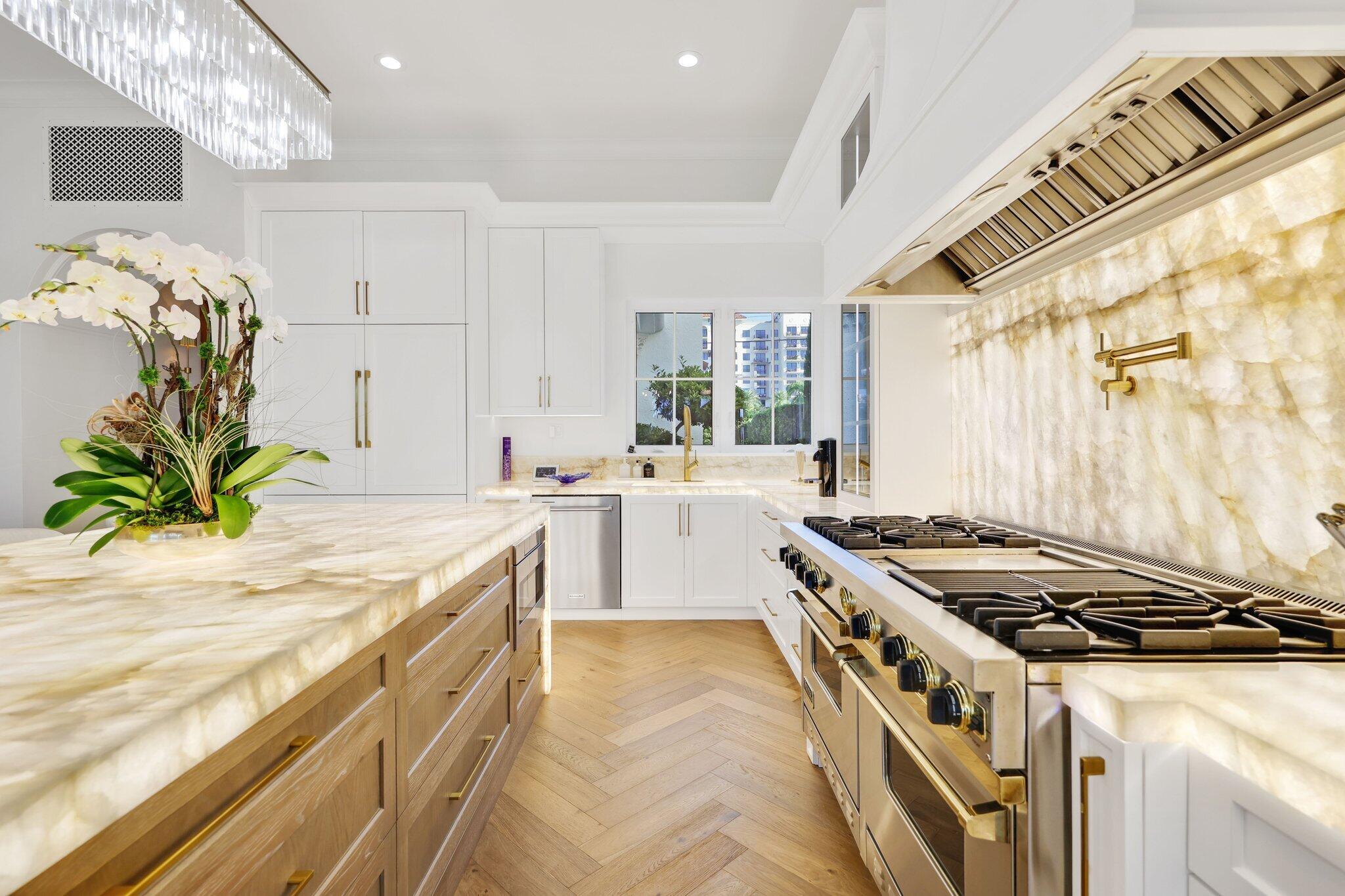 340 East Royal Palm Road Boca Raton, FL 33432 - Photo 8 of 59 a kitchen that has a sink and a stove