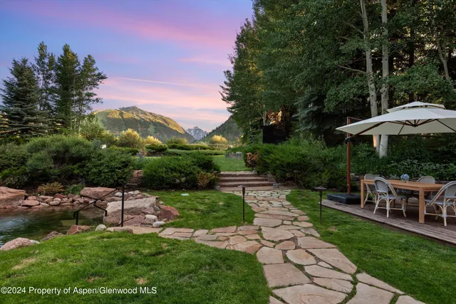 a view of an entryway with a hallway and interior of the house