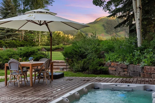 a kitchen with a table and chairs