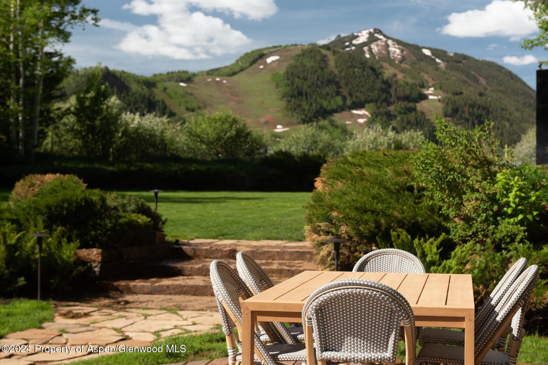 73 Hideaway Lane Aspen, CO 81611 - Photo 29 of 100 a view of a chairs and table in backyard