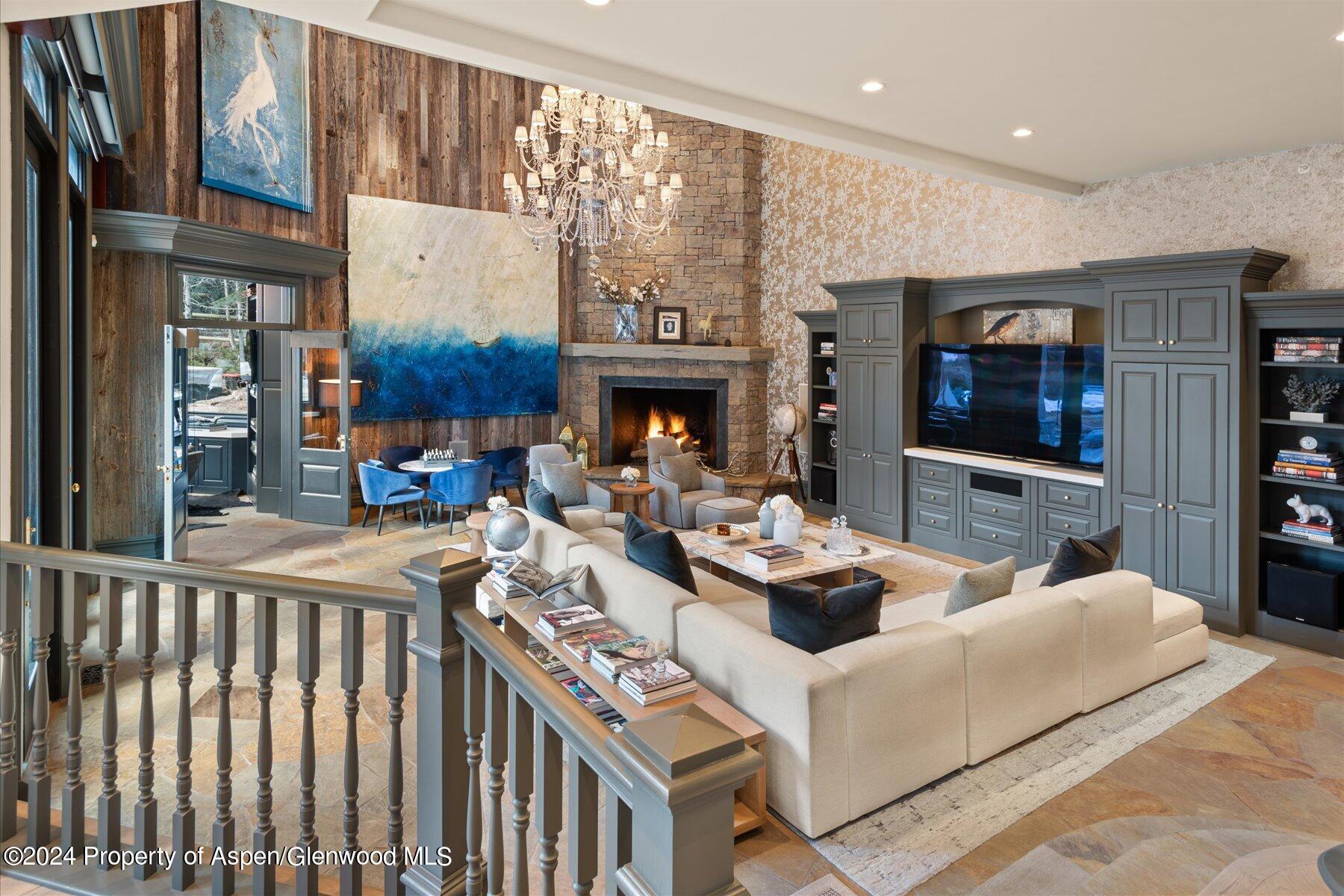 73 Hideaway Lane Aspen, CO 81611 - Photo 43 of 100 a living room with fireplace furniture and a flat screen tv