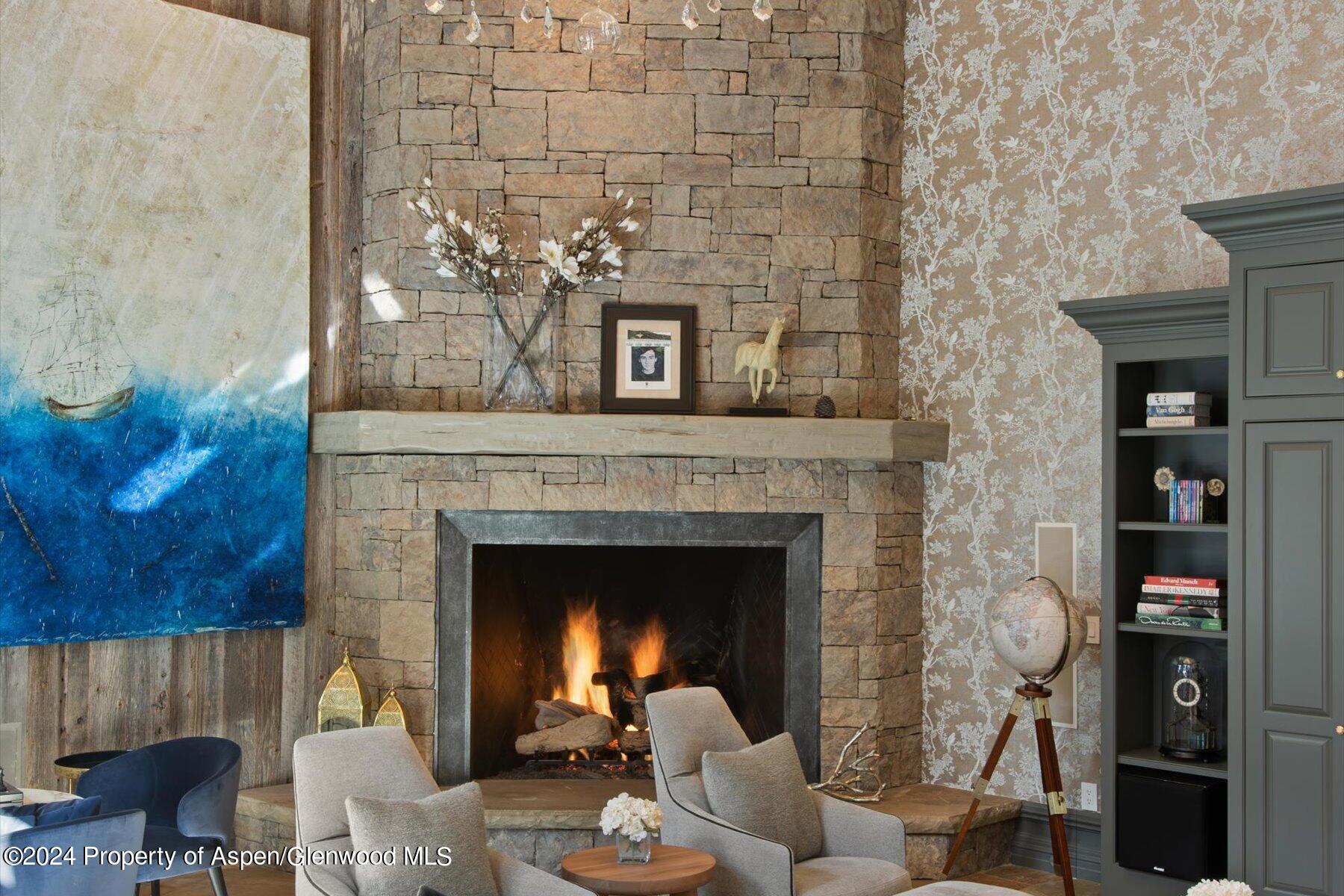 73 Hideaway Lane Aspen, CO 81611 - Photo 44 of 100 a living room with furniture and a fireplace