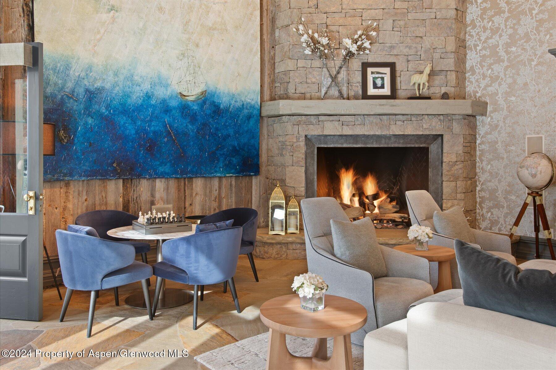 73 Hideaway Lane Aspen, CO 81611 - Photo 46 of 100 a living room with furniture and a fireplace