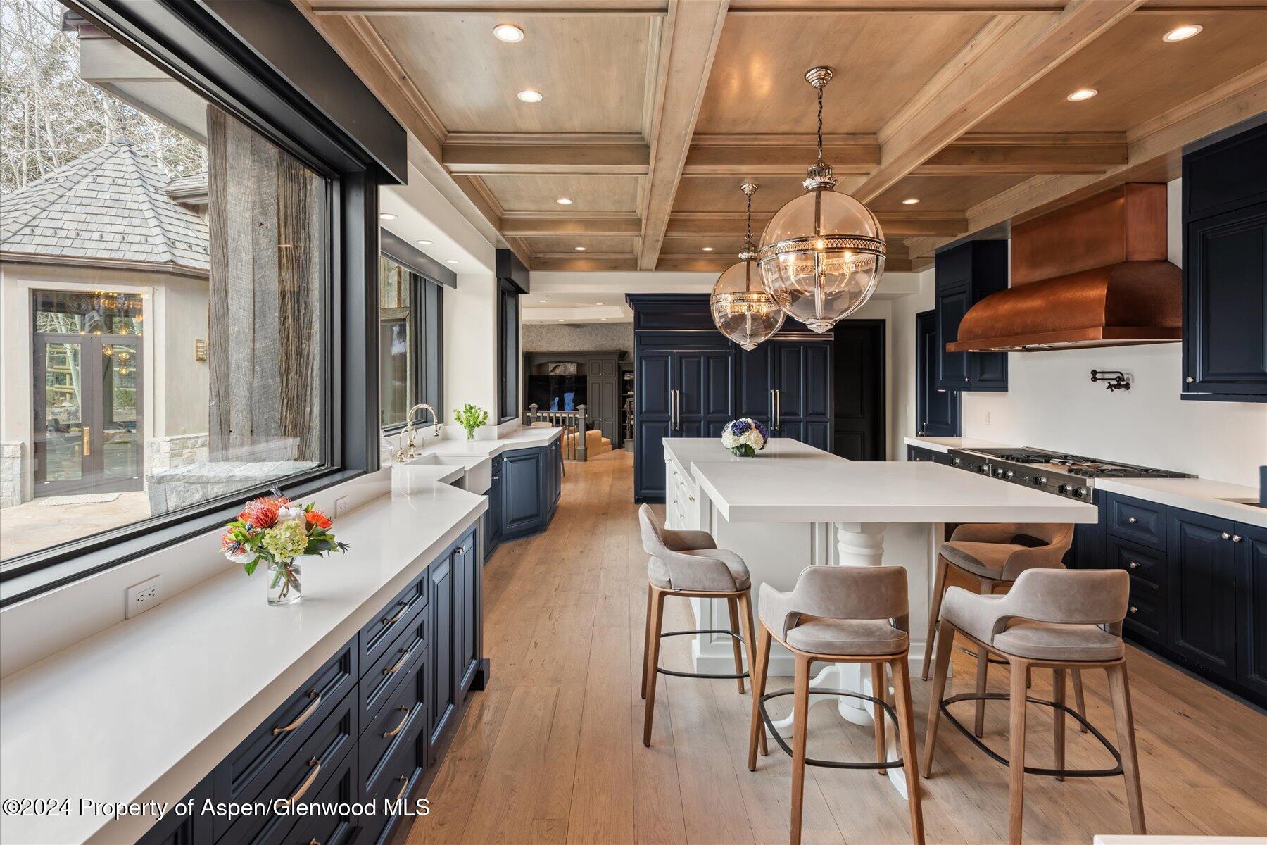 73 Hideaway Lane Aspen, CO 81611 - Photo 57 of 100 a kitchen with a table and chairs