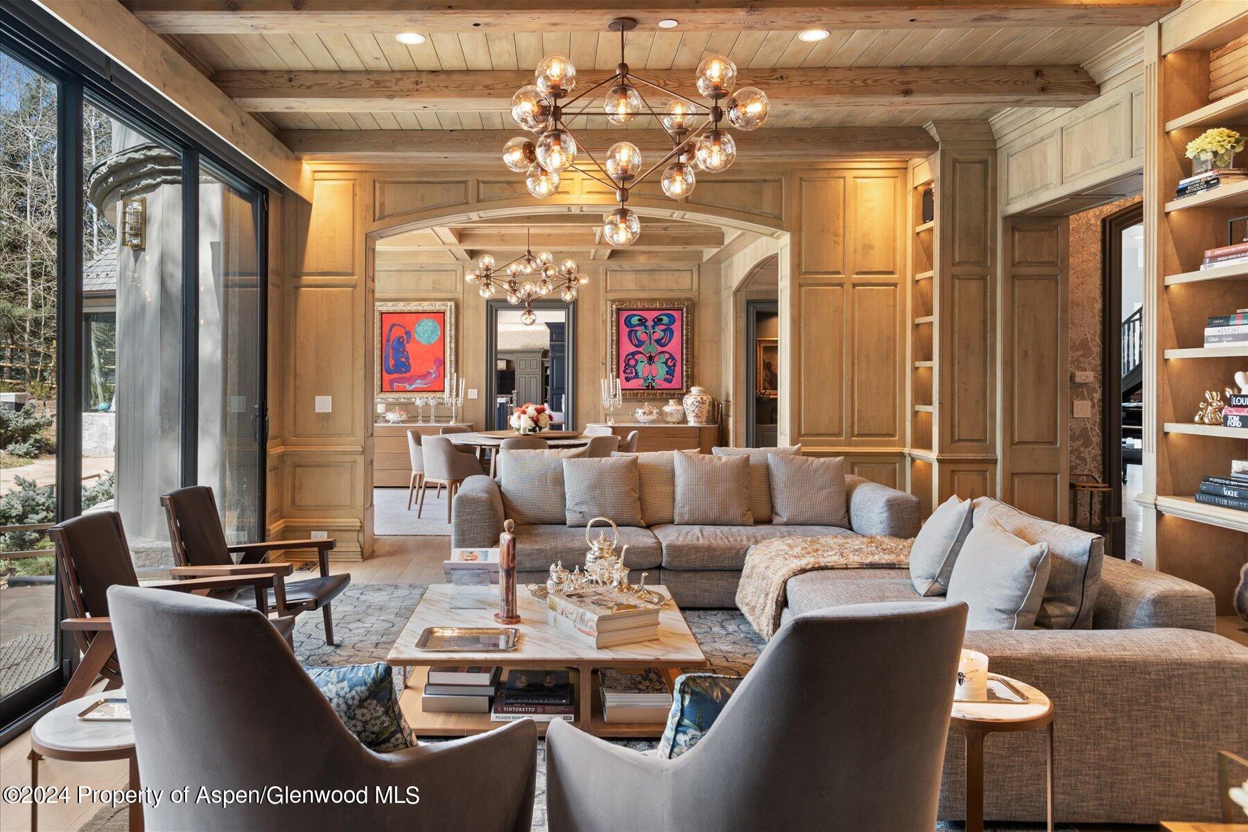 73 Hideaway Lane Aspen, CO 81611 - Photo 65 of 100 a living room with furniture and a chandelier