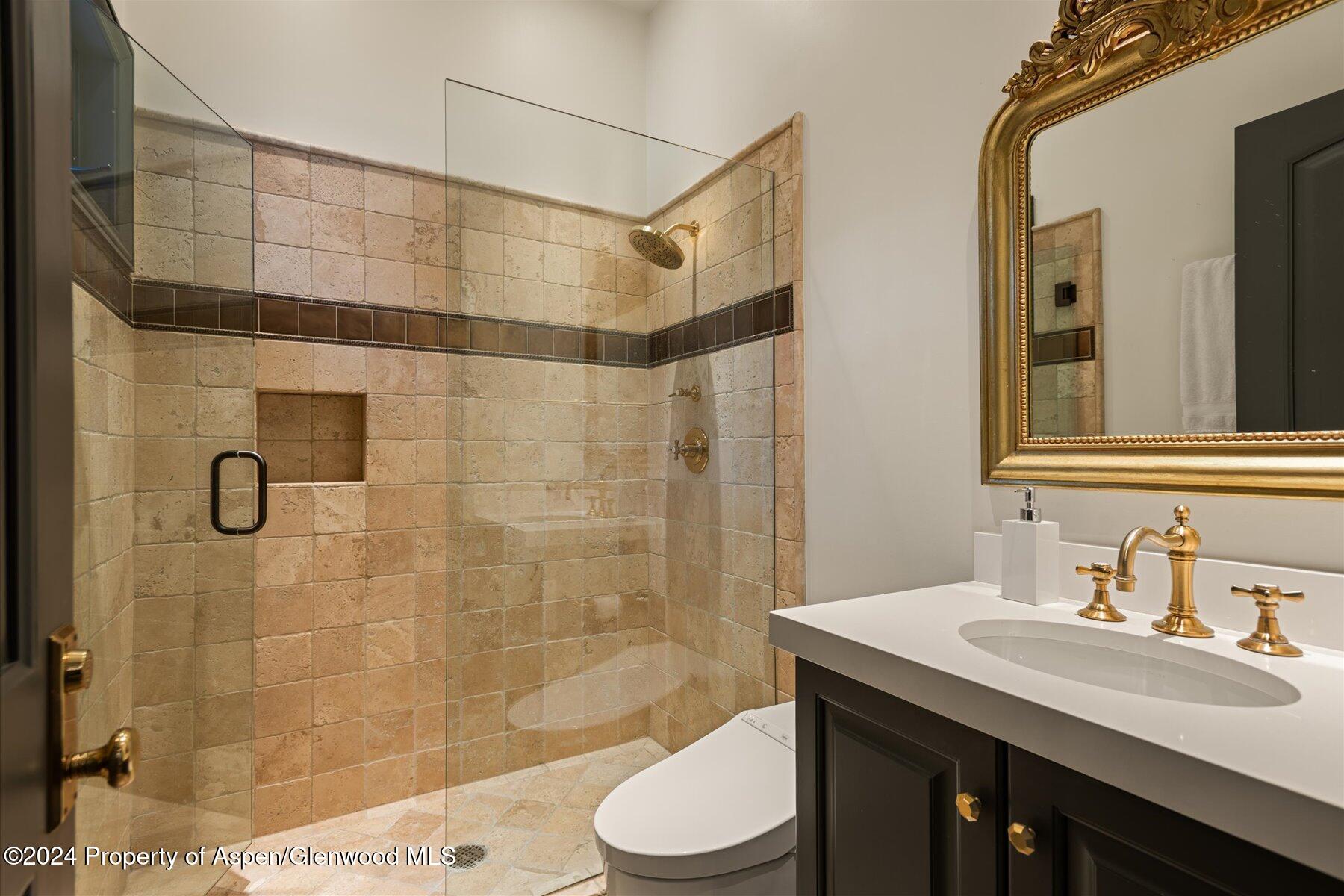 73 Hideaway Lane Aspen, CO 81611 - Photo 75 of 100 a bathroom with a sink a toilet and shower