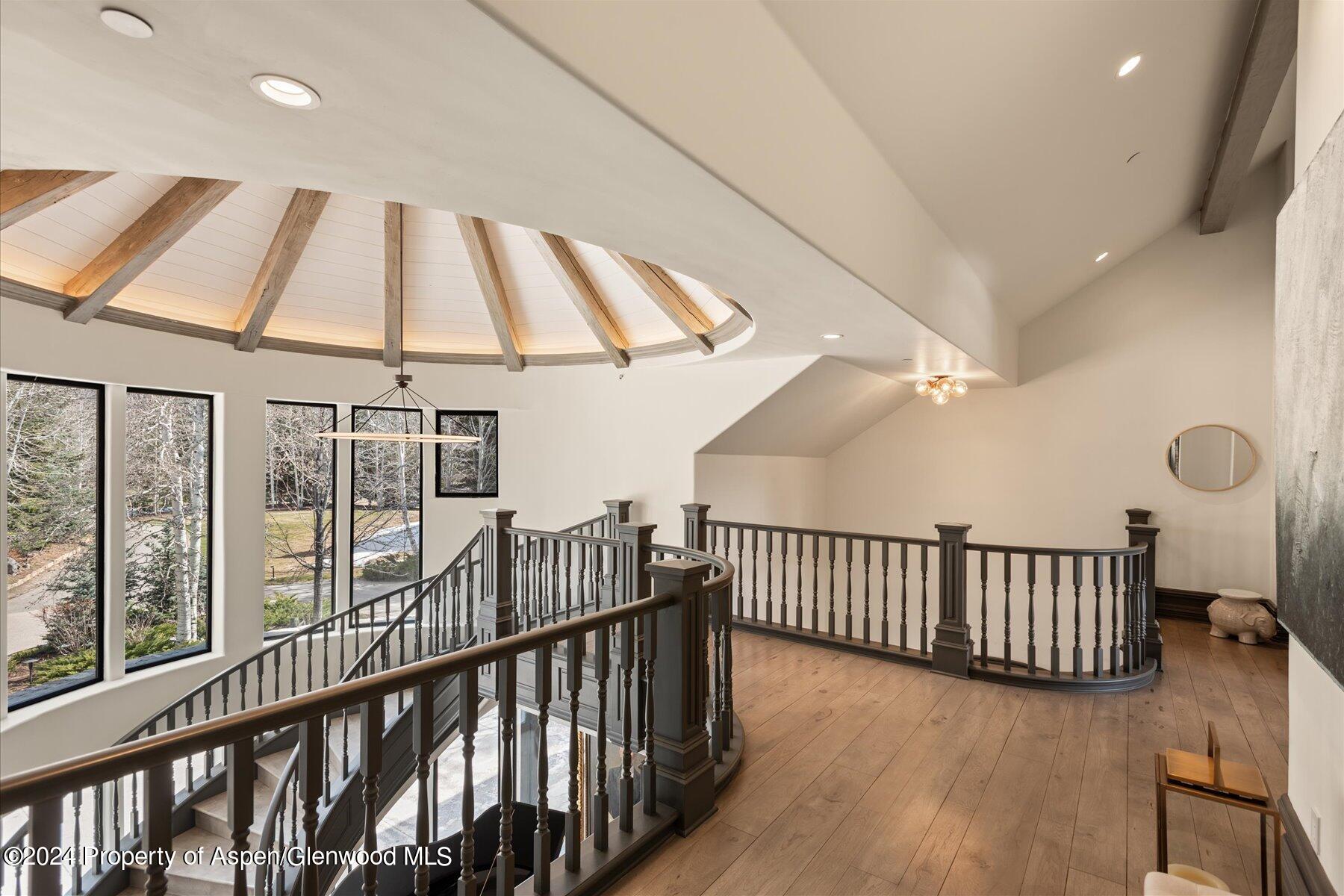 73 Hideaway Lane Aspen, CO 81611 - Photo 77 of 100 a view of staircase with railing and a chandelier