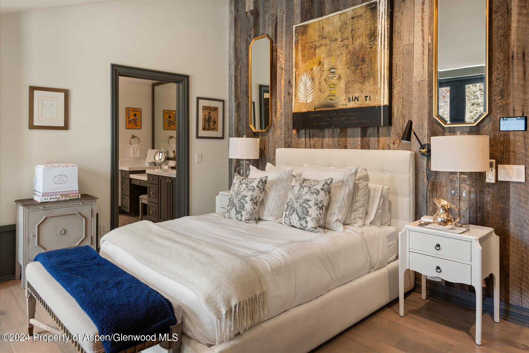 73 Hideaway Lane Aspen, CO 81611 - Photo 89 of 100 a bedroom with a bed and wooden floor