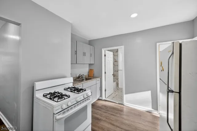 a kitchen with a stove and a refrigerator