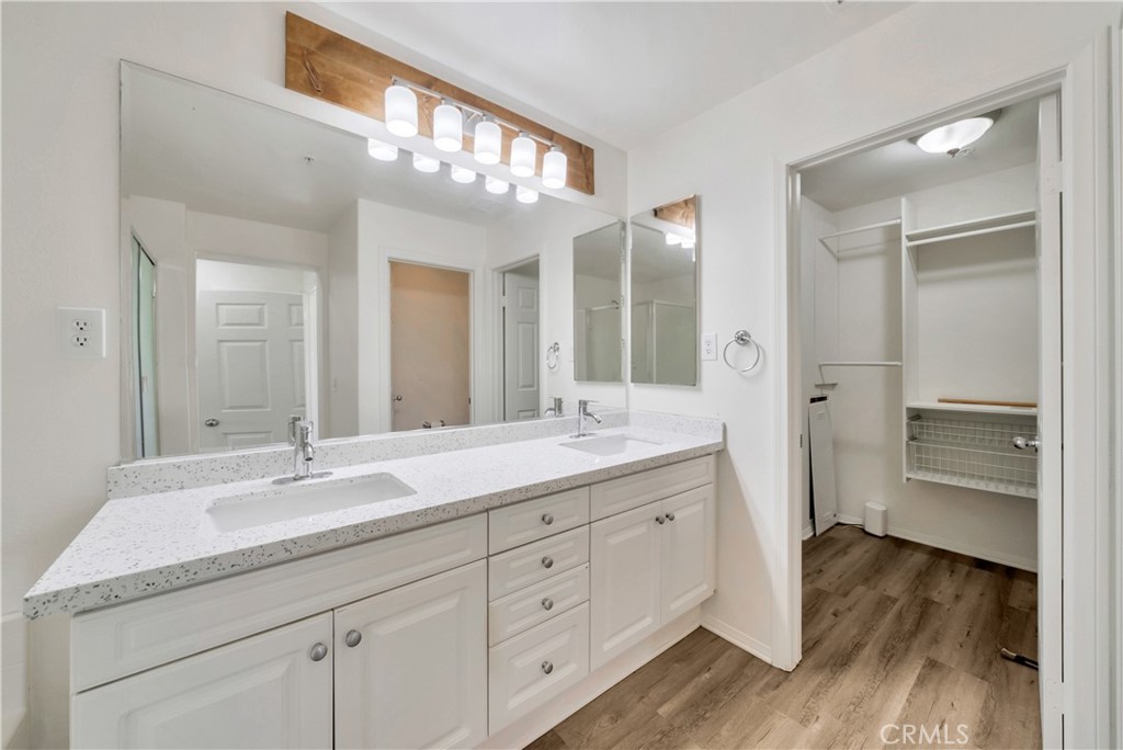 5 Flowerdale Ladera Ranch, CA 92694 - Photo 12 of 22 a spacious bathroom with a granite countertop sink a mirror and a shower