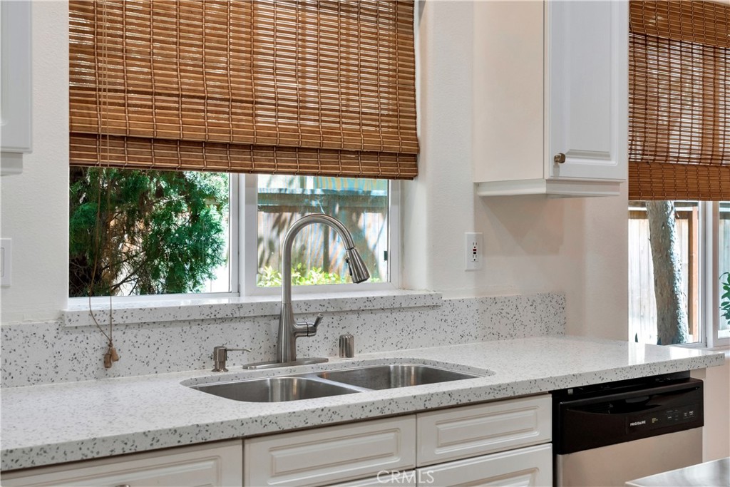 5 Flowerdale Ladera Ranch, CA 92694 - Photo 6 of 22 a kitchen with a sink a counter space and a window