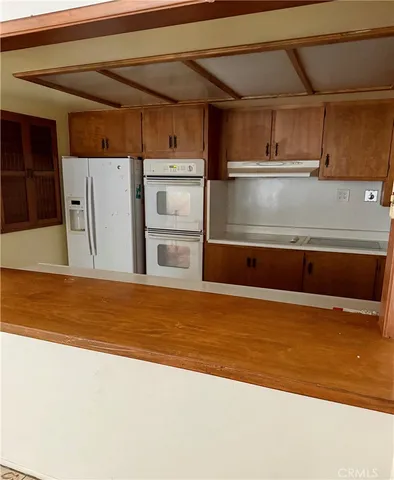 a view of a kitchen with a sink