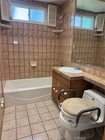 a bed room with furniture and a window