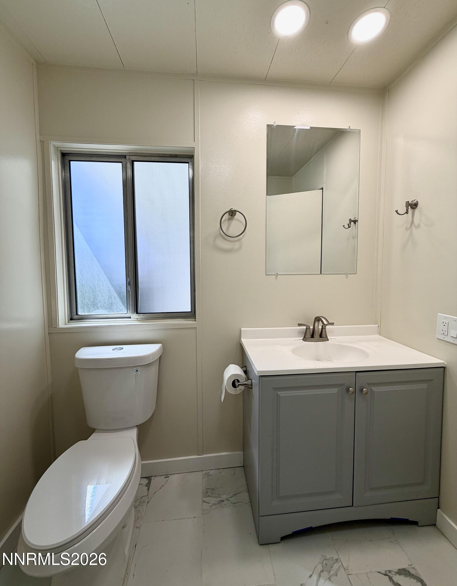 330 Taurus Circle Reno, NV 89521 - Photo 17 of 27 a bathroom with a toilet sink and mirror