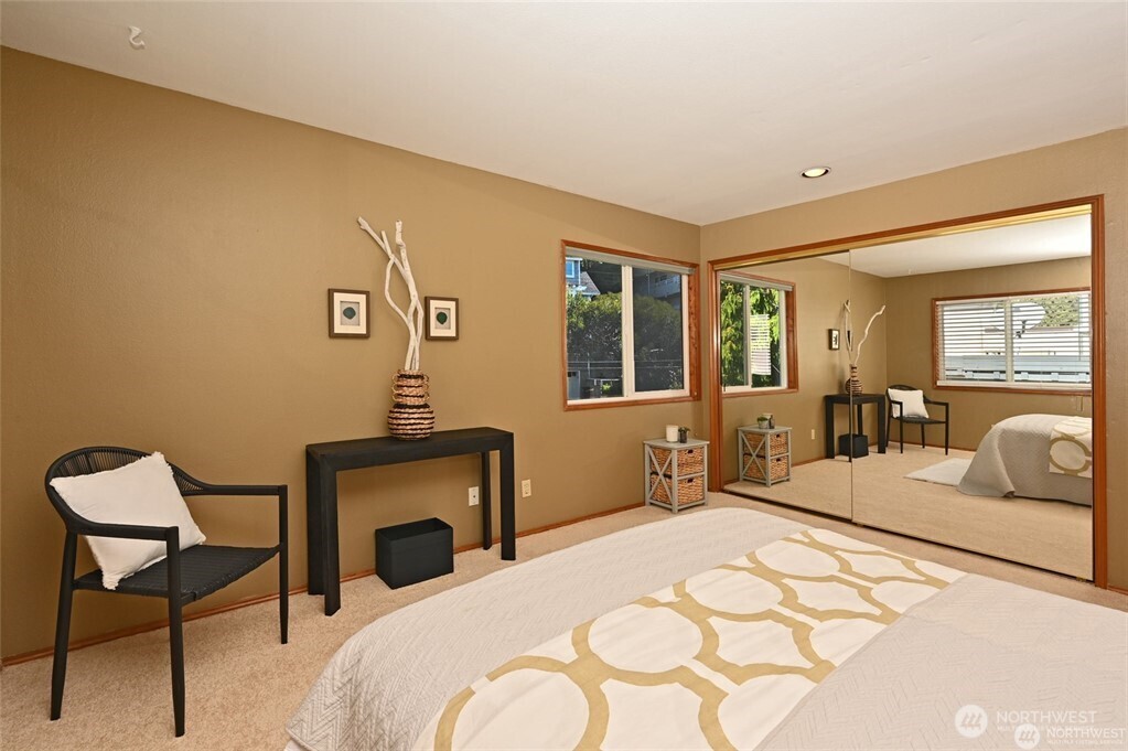 4226 Beach Drive Southwest, Unit 303 Seattle, WA 98116 - Photo 13 of 21 a bedroom with a bed and window