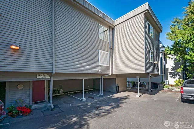 a table and chairs in front of a house