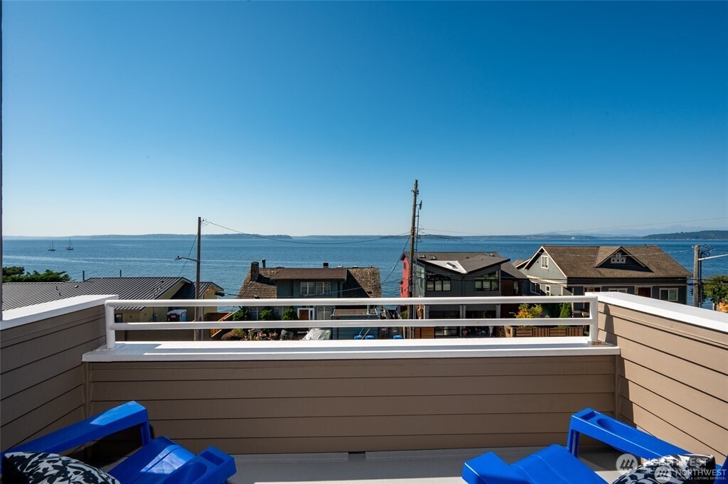 4226 Beach Drive Southwest, Unit 303 Seattle, WA 98116 - Photo 2 of 21 a view of a roof deck with furniture