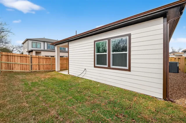a house view with a backyard space