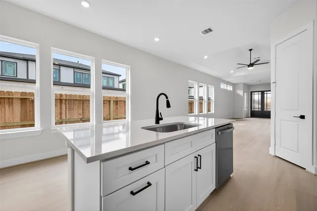 a kitchen with a sink and cabinets