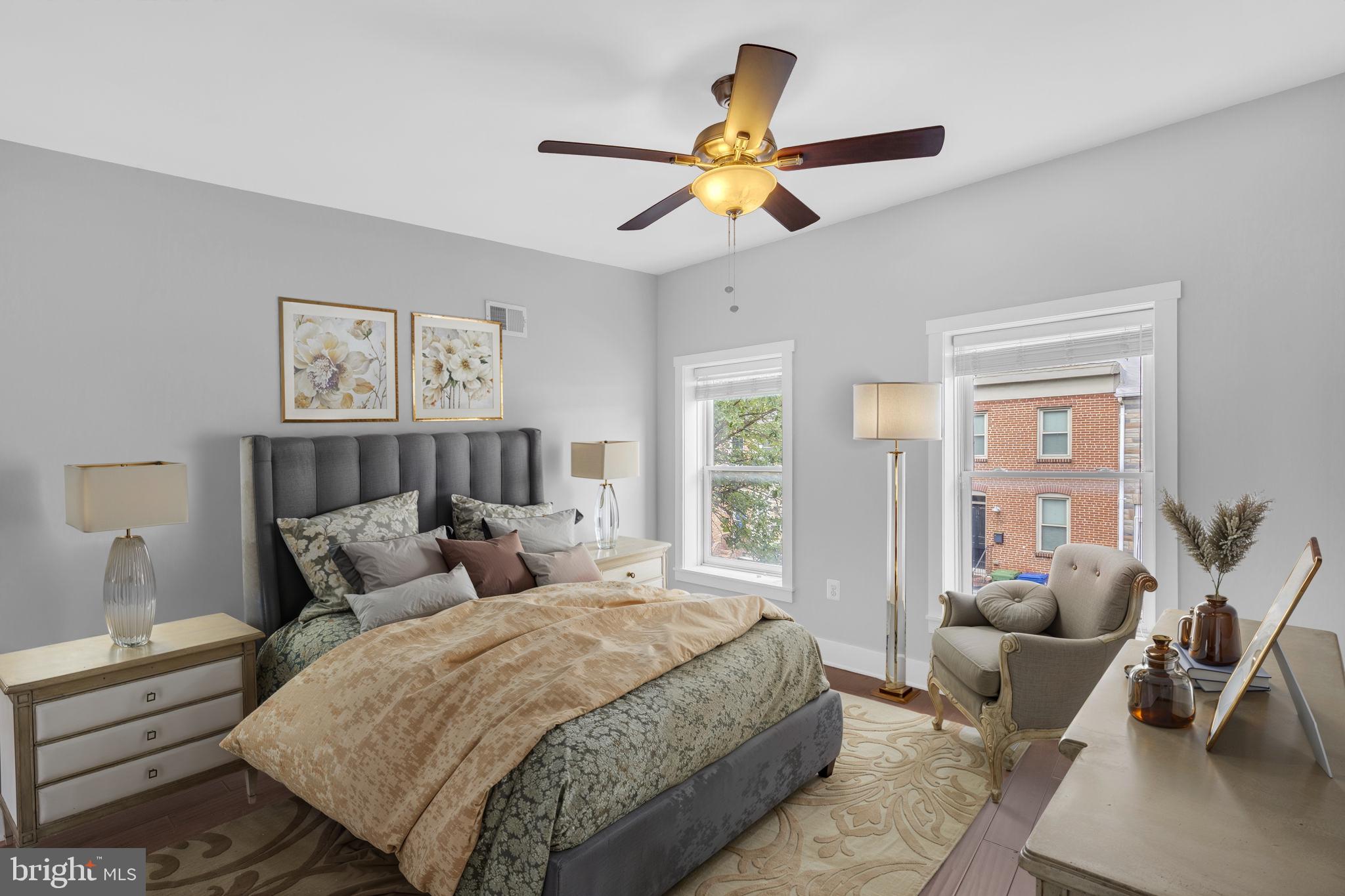 1827 Light Street Baltimore, MD 21230 - Photo 12 of 28 a bedroom with a bed and wooden floor