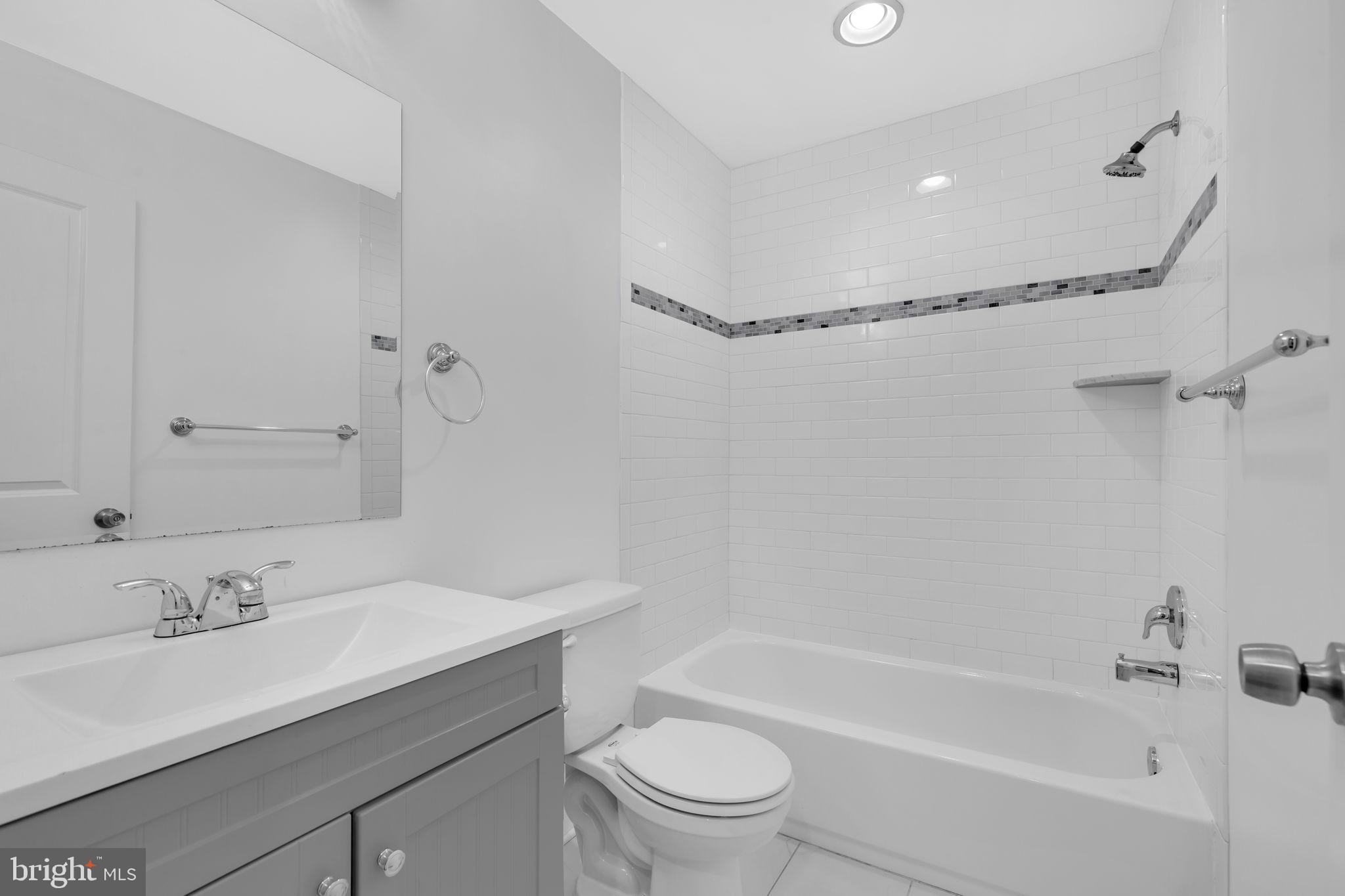 1827 Light Street Baltimore, MD 21230 - Photo 14 of 28 a bathroom with a sink a toilet and a bathtub