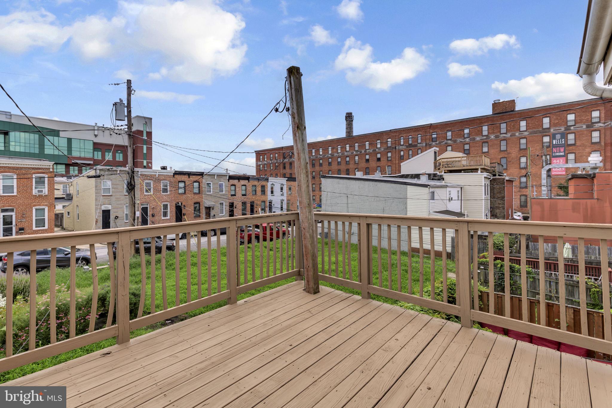 1827 Light Street Baltimore, MD 21230 - Photo 19 of 28 a view of a balcony with wooden floor