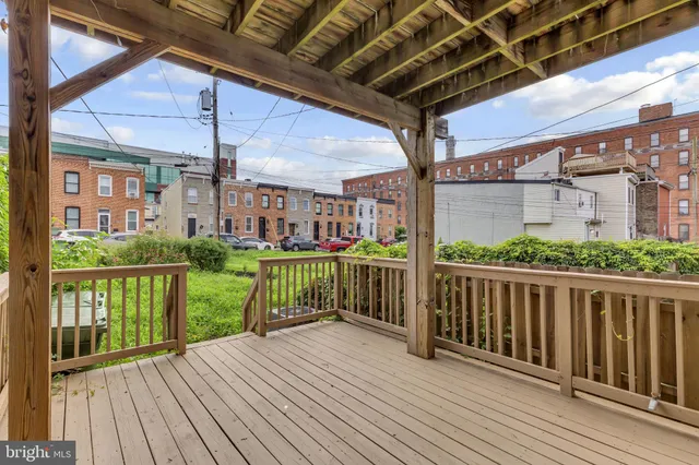 a view of a porch with wooden floor and outdoor space