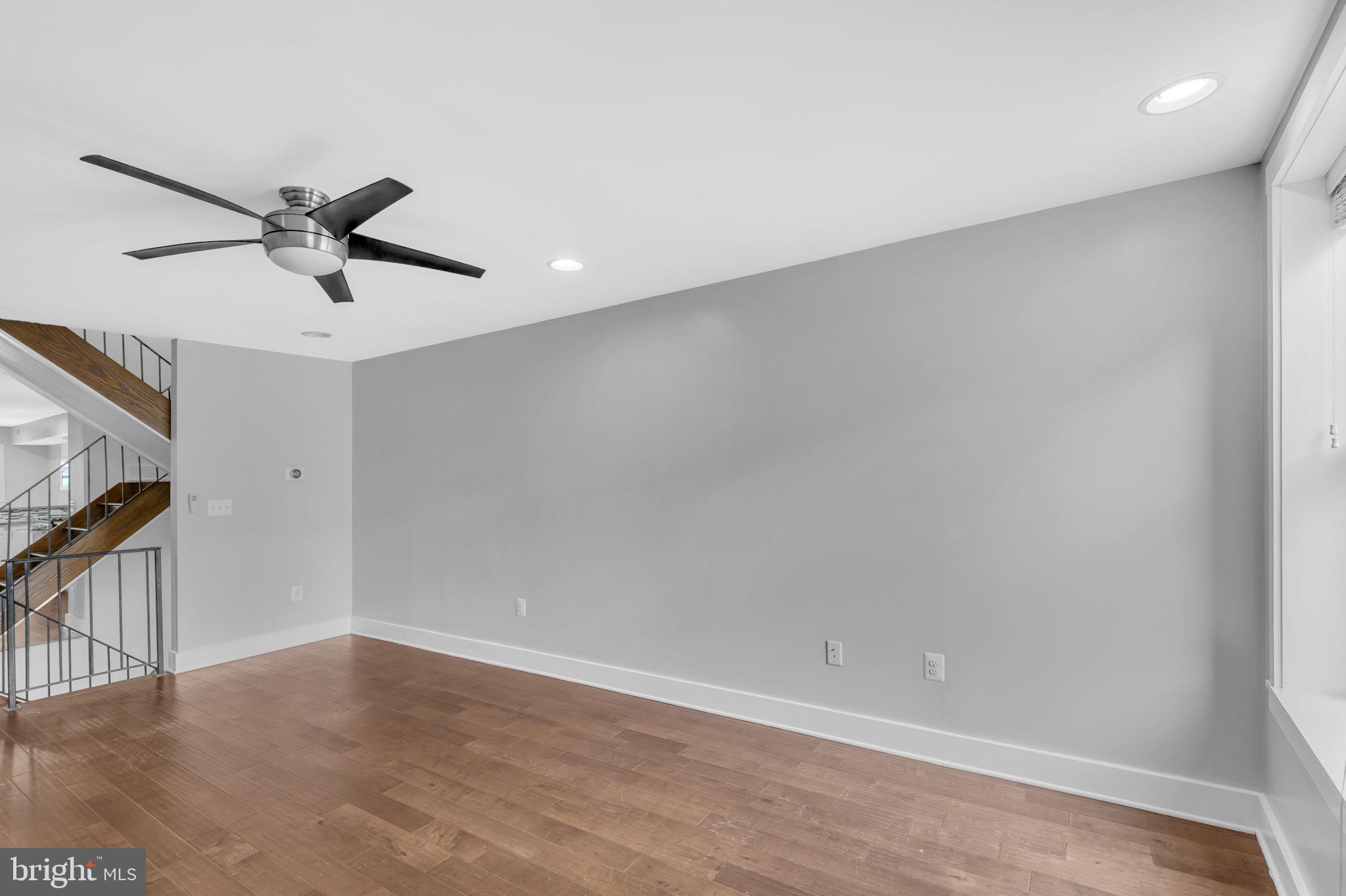 1827 Light Street Baltimore, MD 21230 - Photo 3 of 28 a view of a ceiling fan and wooden floor