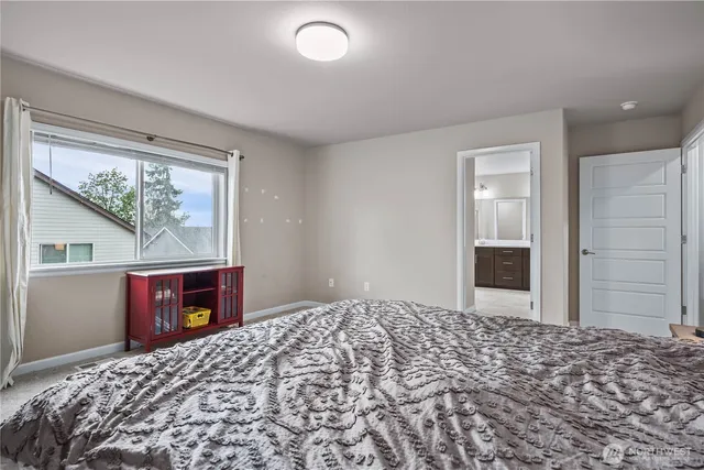 a bedroom with a bed and a dresser