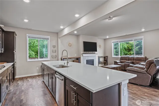 a kitchen with a stove a sink and a refrigerator