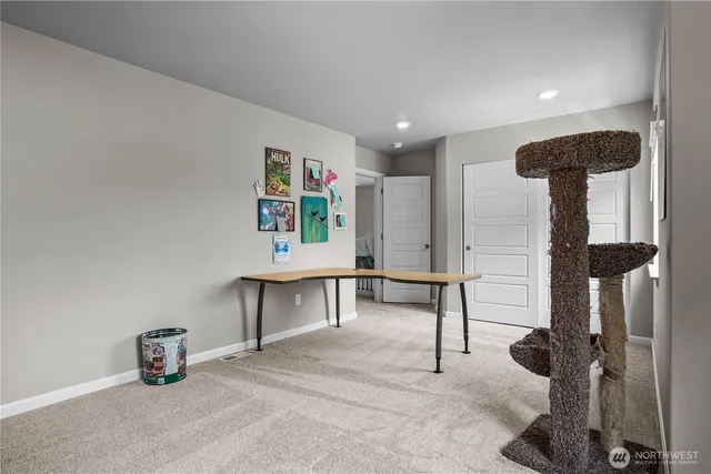 a room with lots of furniture and potted plants