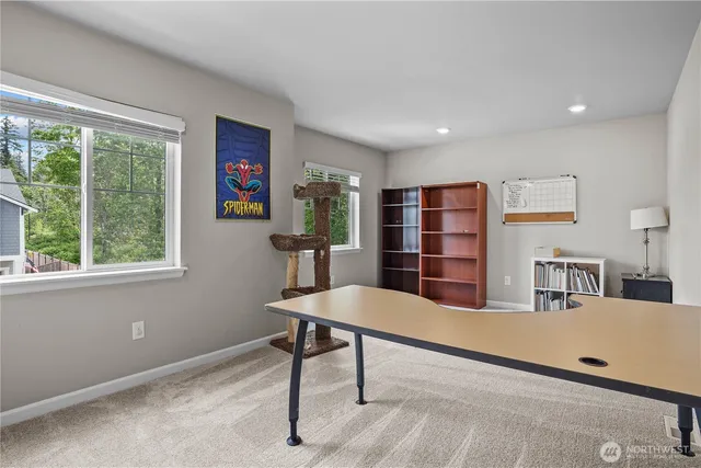 a living room with furniture a table and a large window