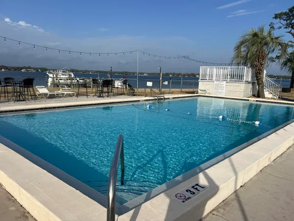 a view of swimming pool from a balcony