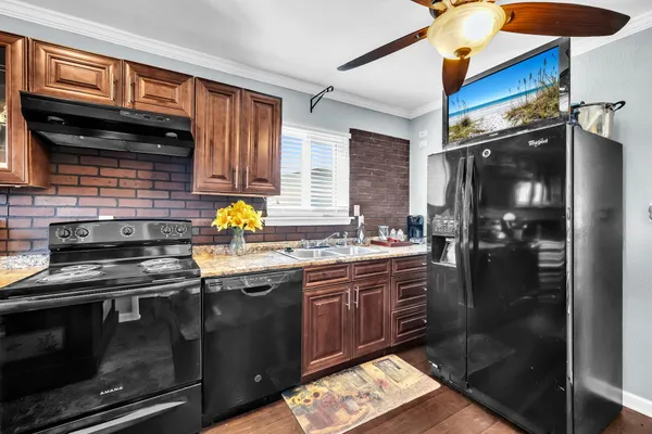 a view of a livingroom with furniture and a flat screen tv