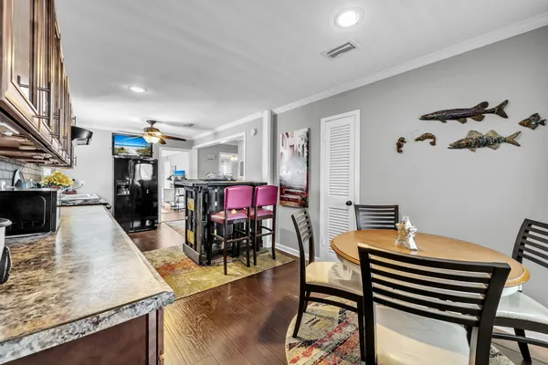 a white toilet sitting next to a shower curtain