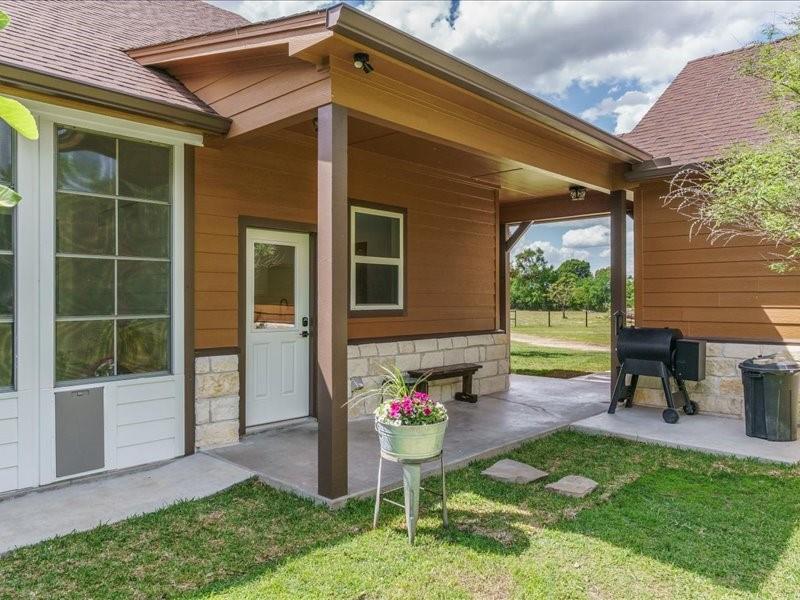6969 Highway 198 Canton, TX 75103 - Photo 13 of 40 a view of a backyard with a garden and a table