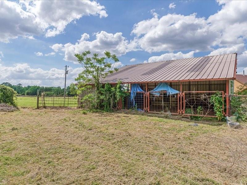 6969 Highway 198 Canton, TX 75103 - Photo 18 of 40 a backyard of a house with table and chairs
