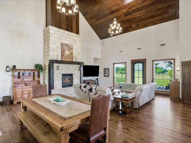 6969 Highway 198 Canton, TX 75103 - Photo 21 of 40 a living room with furniture a fireplace a flat screen tv and a large window